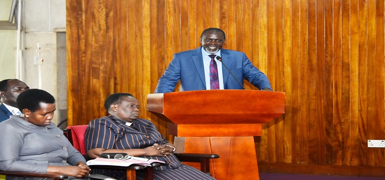 Hon. Bwanika who preached during the prayers. Seated next to him is the Anglican Chaplain, Rev Christine Shimanya